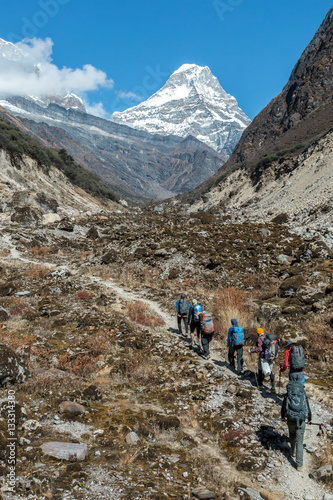 Hikers walking on Mountain Trail vertical