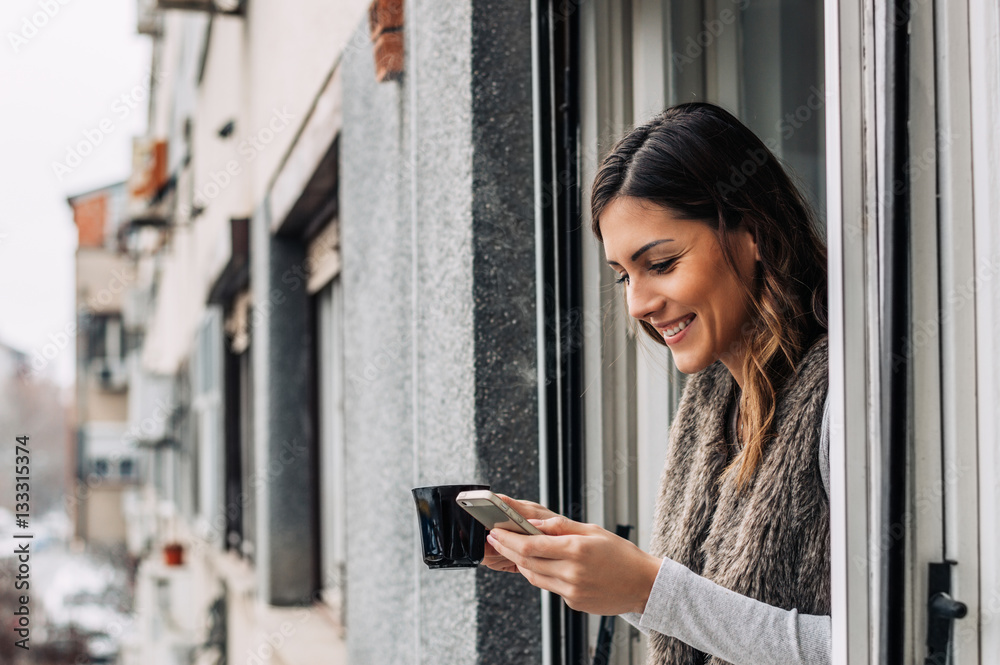 Fototapeta premium Drinking coffee, chilling, message typing. Smartphone and coffee