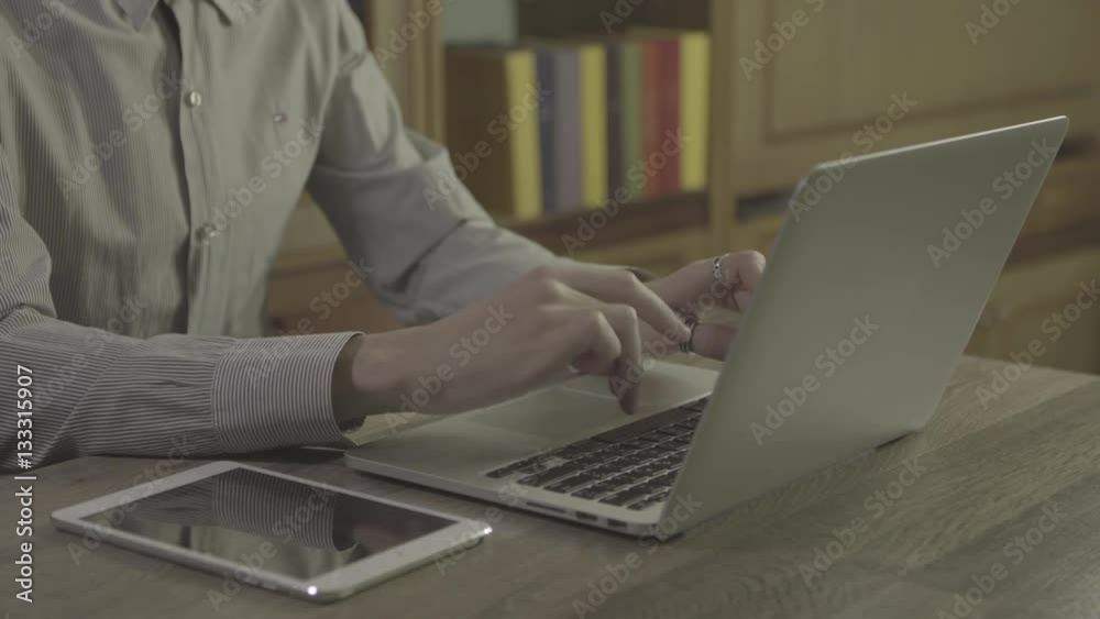 oung man hands using notebook on a table, 4k ungraded footage shot in 24fps oung man hands using notebook on a table, 4k ungraded footage shot in 24fps