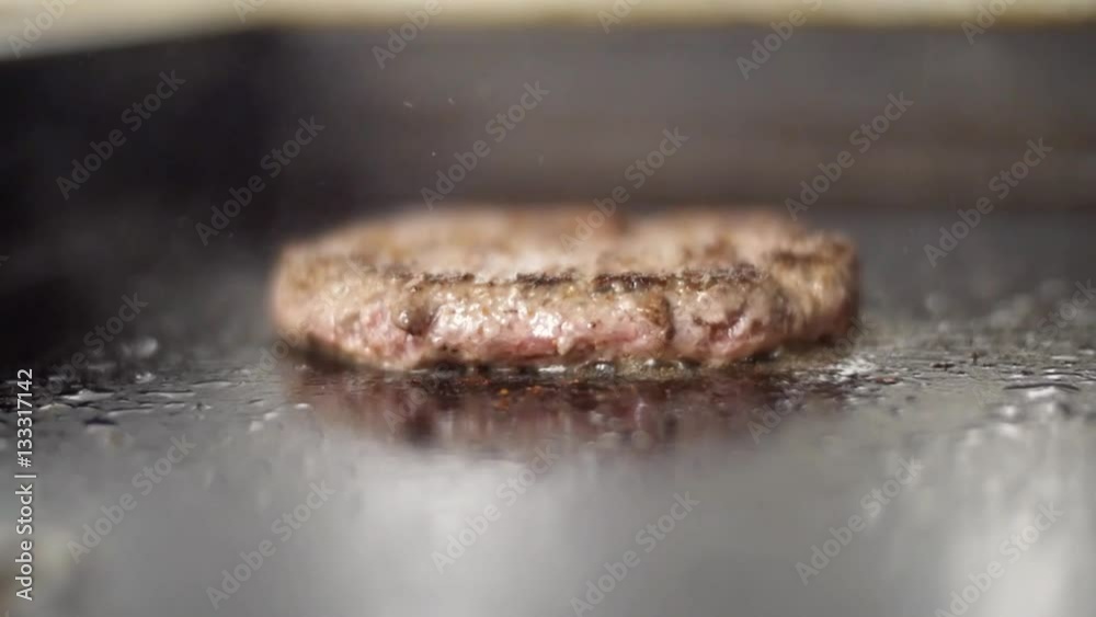 Burger on a grill. A barbecue scene with burger. Burger on a grill. A barbecue scene with burger.