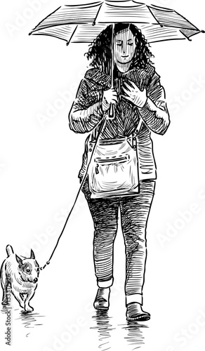 girl with her dog walk in the rain 