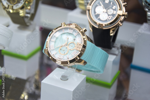 Luxury stainless steel watch displayed.
