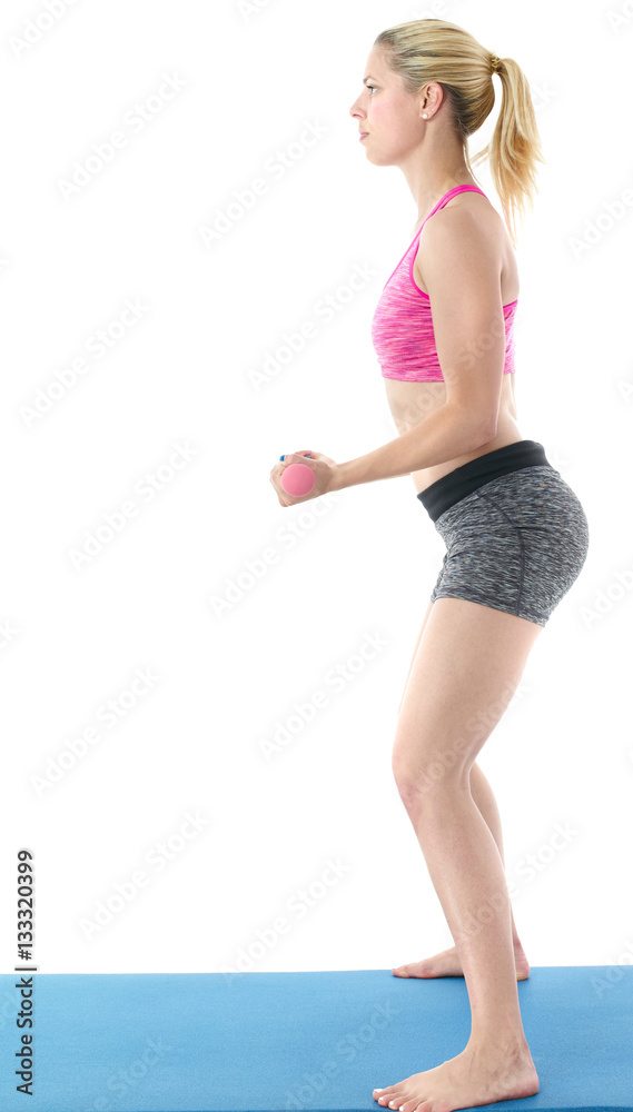 Woman making pilates mat exercises Woman making pilates mat exercises