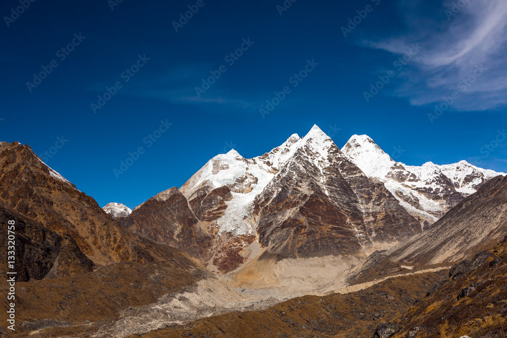 Daylight View of Group of pyramidal Shape Mountain Peaks