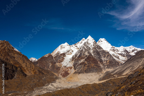 Daylight View of Group of pyramidal Shape Mountain Peaks