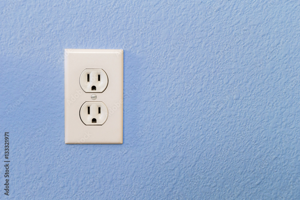 Electrical Sockets In Colorful Blue Wall of House. Electrical Sockets In Colorful Blue Wall of House.