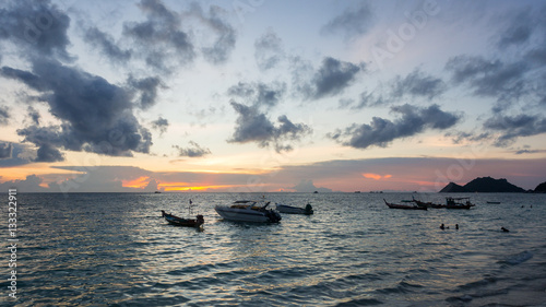 Sunset landscape of the sea and boat in twilight time at koh tao, thailand