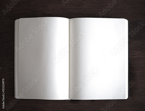 open plain notebook on wooden table top