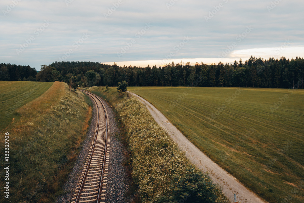 railroad in landscape between fields, green, nature