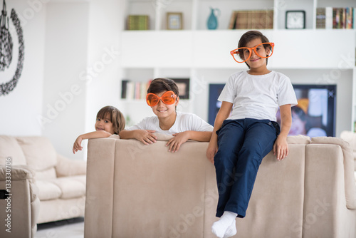 Funny kids with silly glasses on eyes at home © Jasmin Merdan