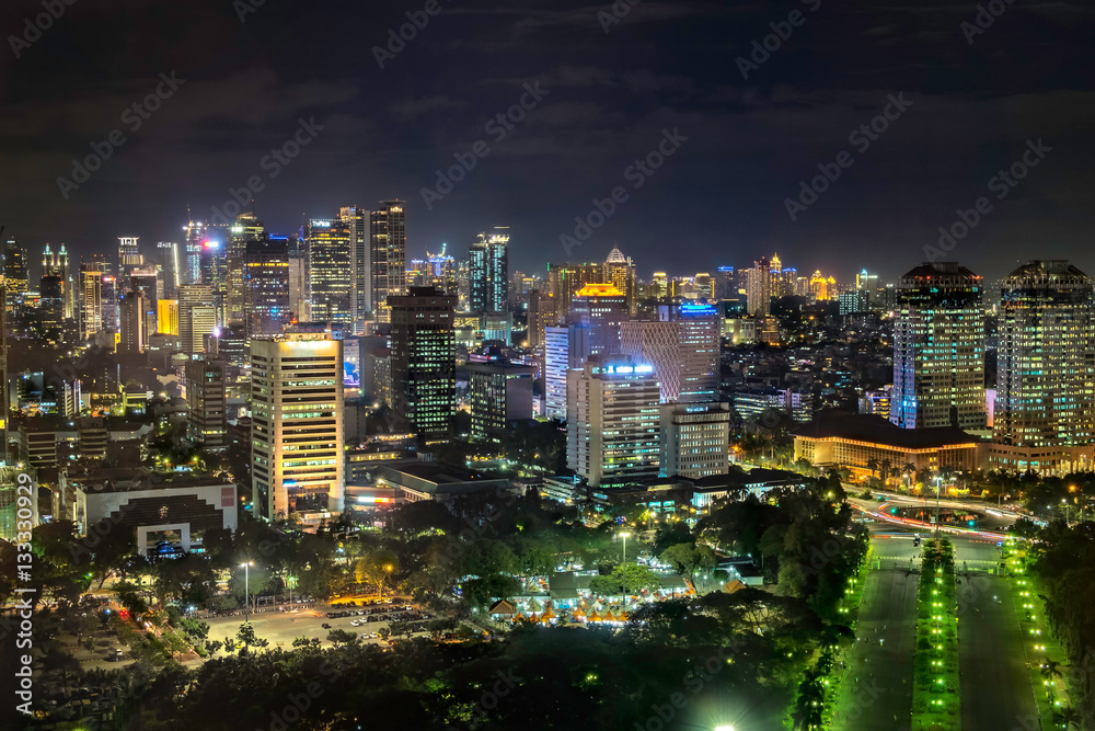 Beautiful skyline of Jakarta city, Indonesia showing skyscraper buildings from top, aerial view at night. Beautiful skyline of Jakarta city, Indonesia showing skyscraper buildings from top, aerial view at night.