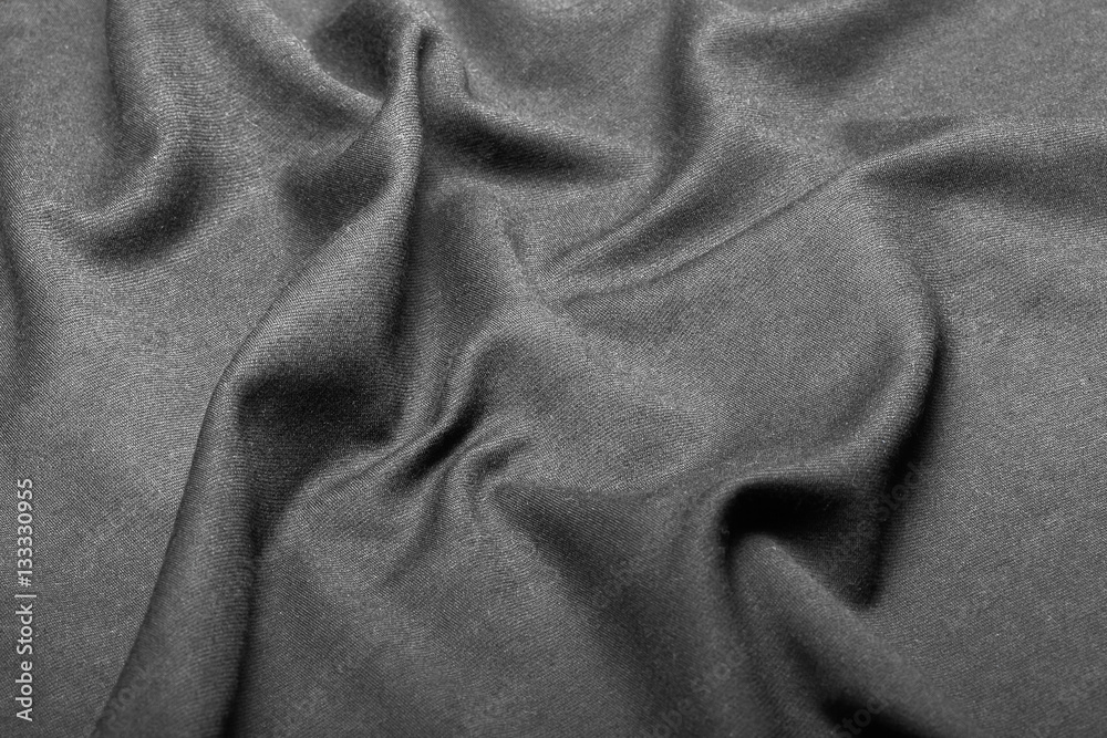 Wall Mural Texture of black fabric put by waves.