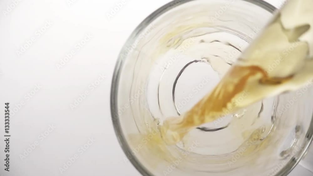 Cloes up of pouring tea into glass tea cup, top view Cloes up of pouring tea into glass tea cup, top view