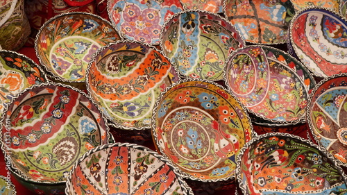 Colorful souvenirs hand painted ceramic utensils  plates and bowls on market