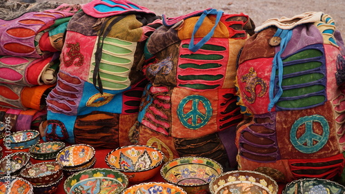 Colorful souvenirs hand painted ceramic utensils, plates and bowls on market