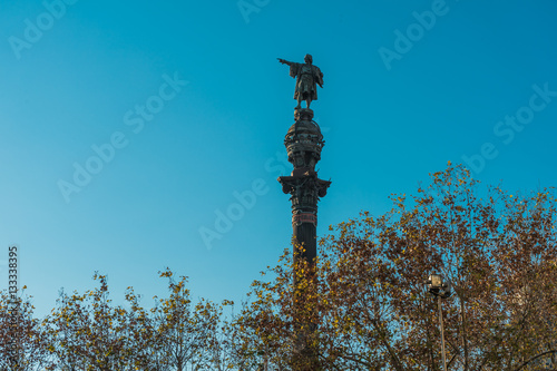columbus monument with trees at barcelona, spain