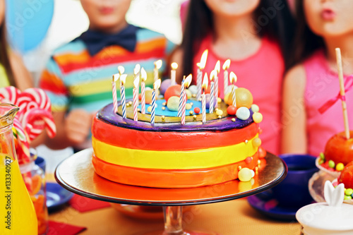 Children blowing candles on...