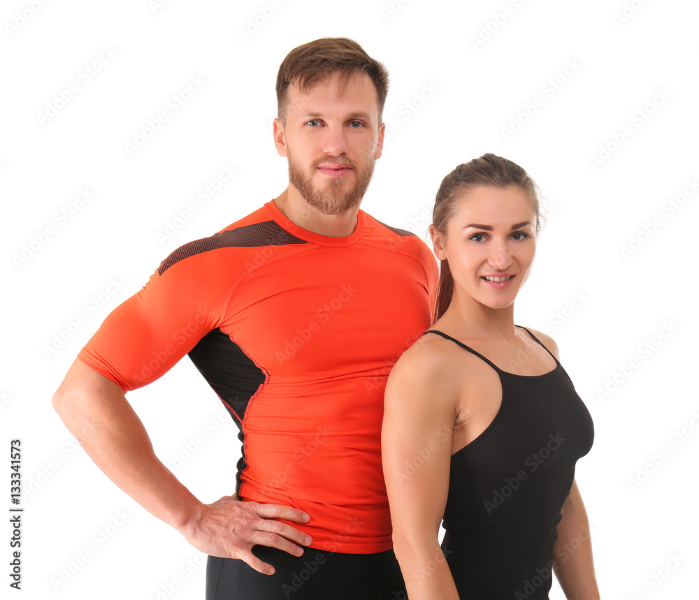 Sporty young couple on white background Sporty young couple on white background