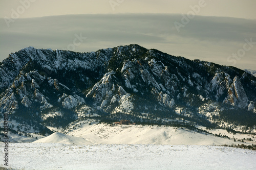 Flatirons Mountains in Boulder, Colorado on a Cold Snowy Winter photo