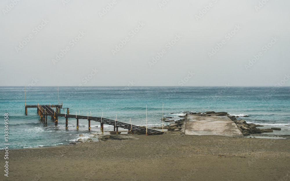 Empty sandy coast at Mediterranean sea in winter after storm in Alanya, Turkey