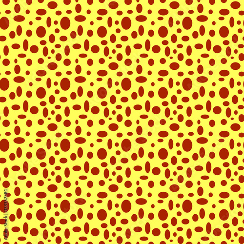 Seamless yellow pattern with brown polka dots in different sizes as a background - Eps10 vector graphics and illustration