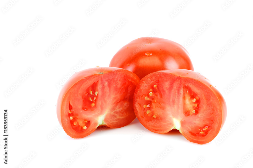 fresh whole tomato and half cut tomato on white background fresh whole tomato and half cut tomato on white background