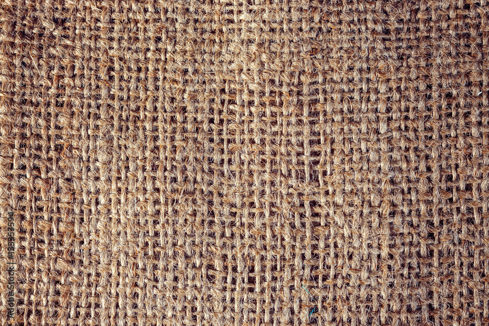 Textured background of a brown burlap bag, close up Textured background of a brown burlap bag, close up