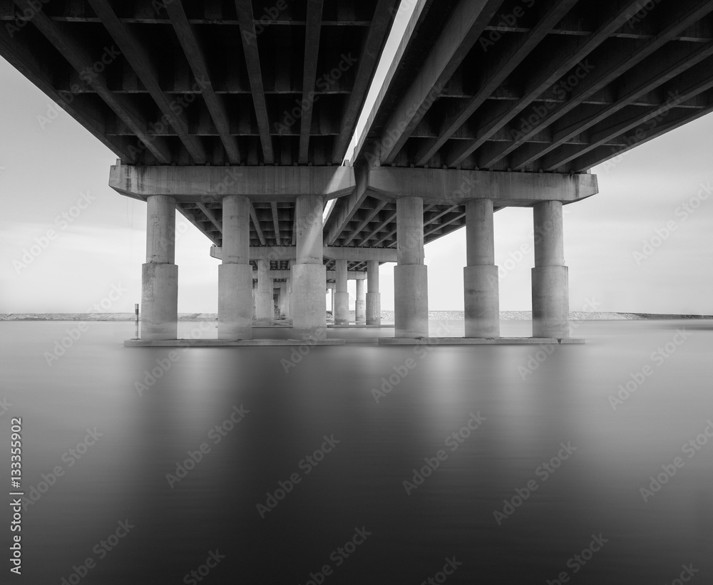 Black and white photo of bridge and river Black and white photo of bridge and river