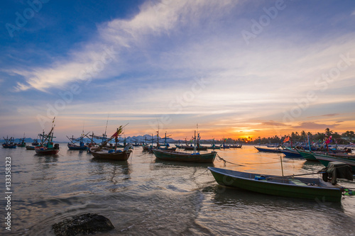 Fishing boat,waves and sunset with blue sky, idustrial background