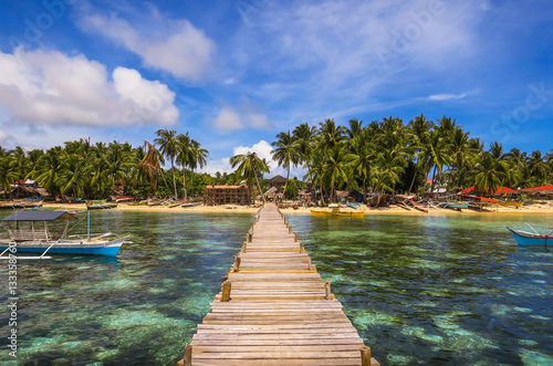 Wooden Dock and Fishing Village Landscape With Tide Pools and Palm Trees - Siargao Island, Mindanao - Philippines photo