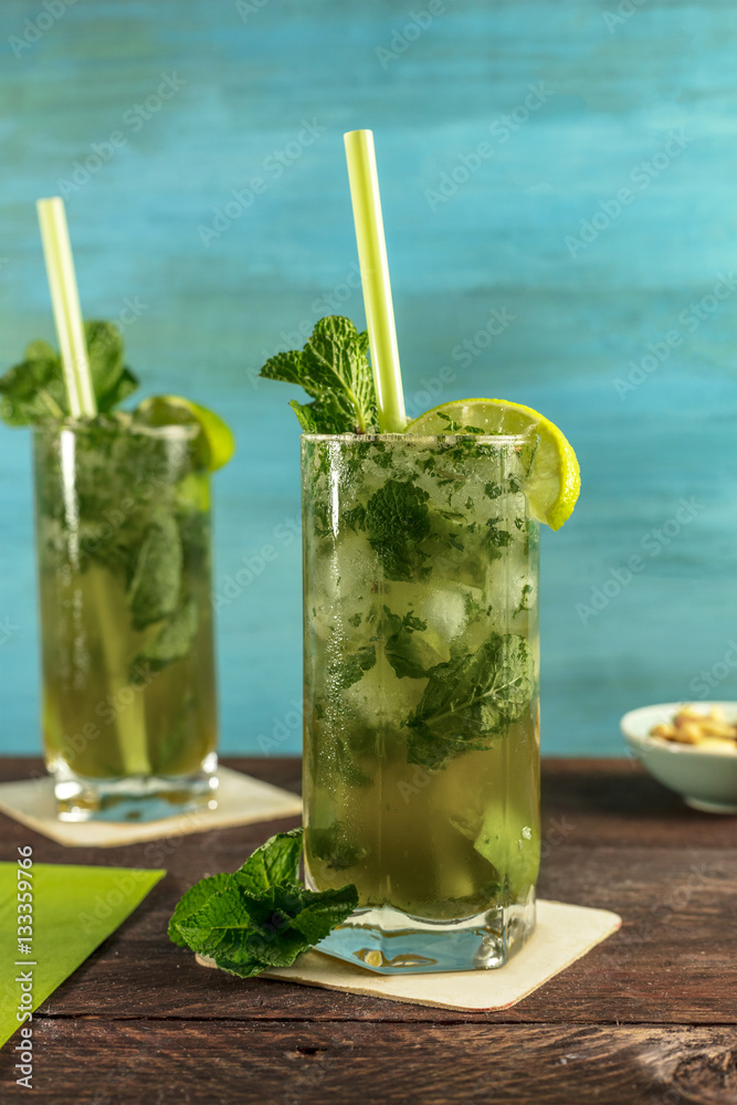 Mojito cocktail with mint leaves and lime Mojito cocktail with mint leaves and lime