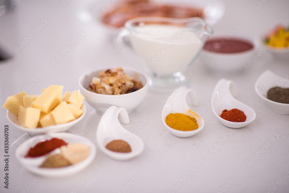 Preparing food in modern white kitchen Preparing food in modern white kitchen