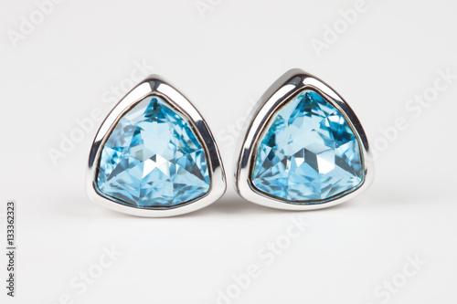 Elegant embedded aquamarine earrings isolated on white backgroun