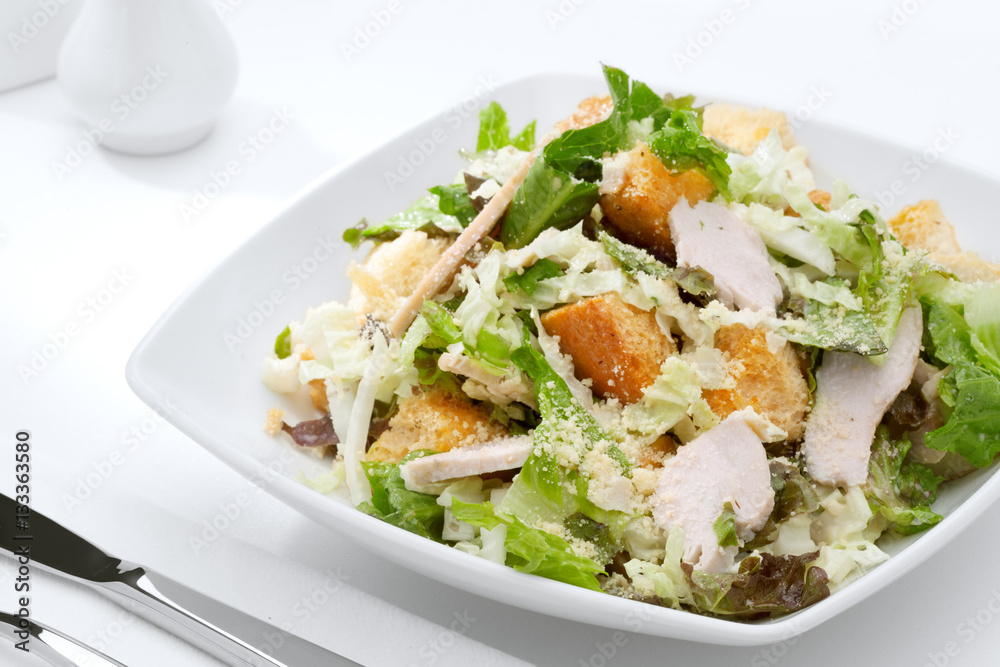 close up view of fresh vegetable salad on white background close up view of fresh vegetable salad on white background