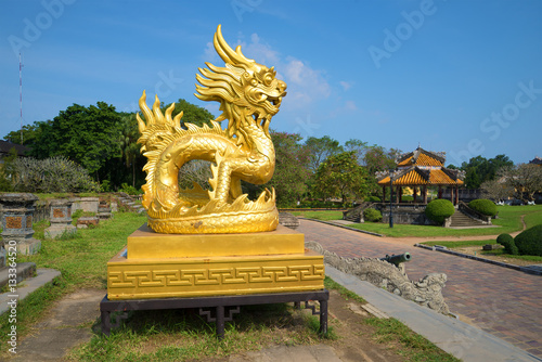 A sculpture of the Gold dragon on a terrace of the forbidden imperial Purple city. The view of the profile. Vietnam  Hue