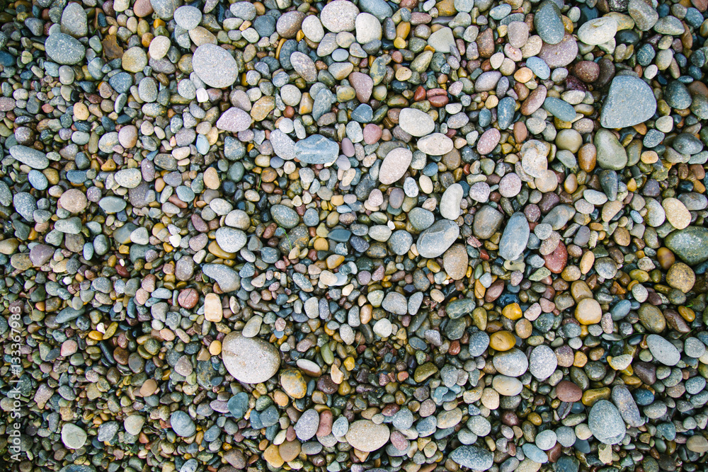 Small sea stones, gravel. Background. Textures Small sea stones, gravel. Background. Textures