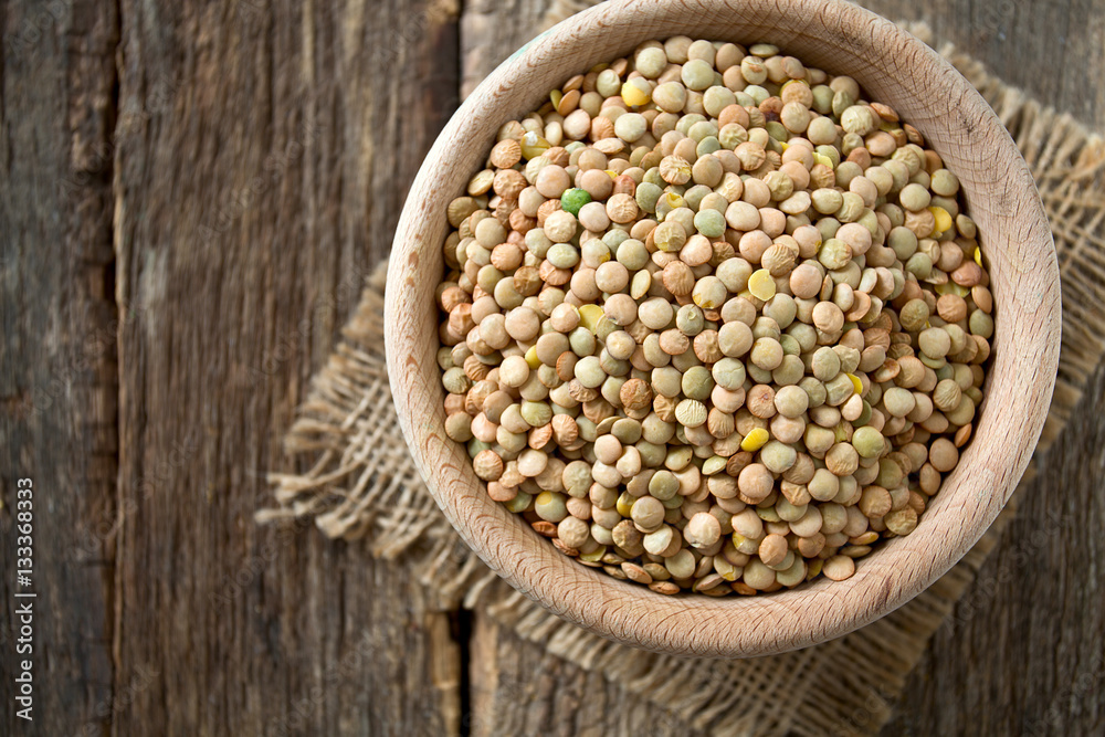 lentils on wooden surface lentils on wooden surface