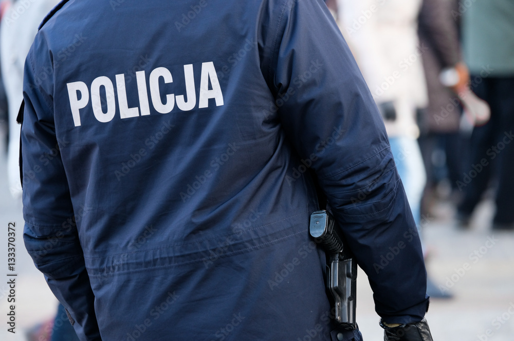 Armed with a pistol police man ready to use weapons Armed with a pistol police man ready to use weapons