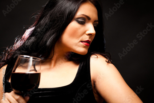 Young Woman Enjoying A Glass Of Wine