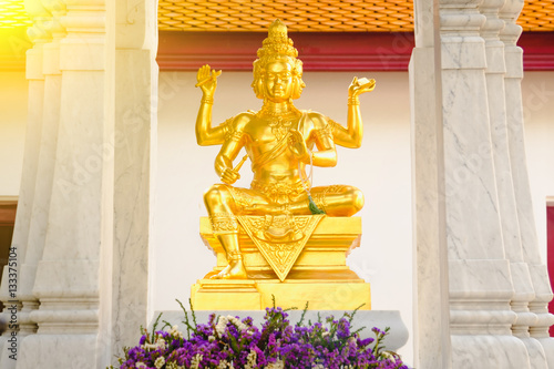 Statue of Hindu God Brahma in Thailand. Beautiful Indian religion traditional lord sculpture with for faces in a Public shrine