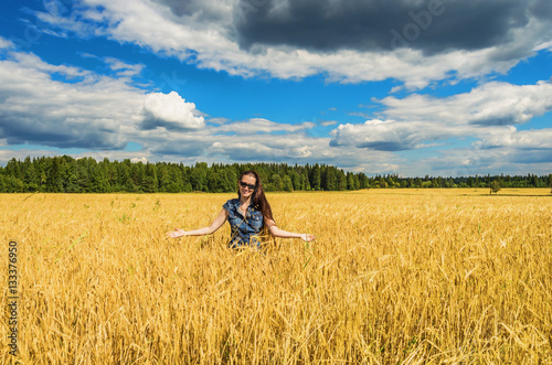 Beautiful woman in wheat field
