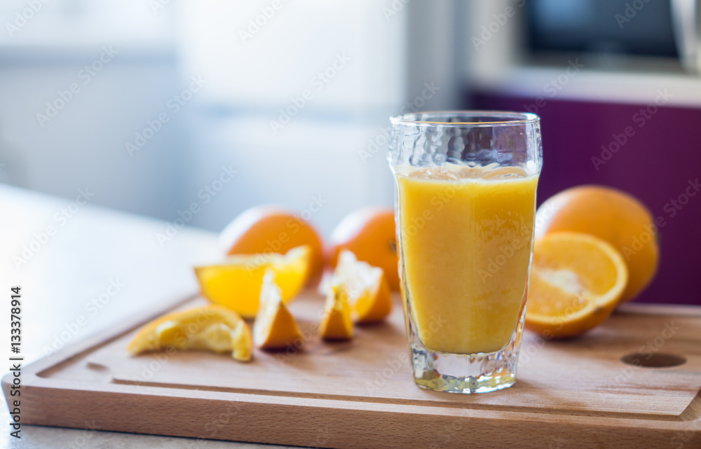 Orange juice on the white table. Shallow depth of field. Orange juice on the white table. Shallow depth of field.