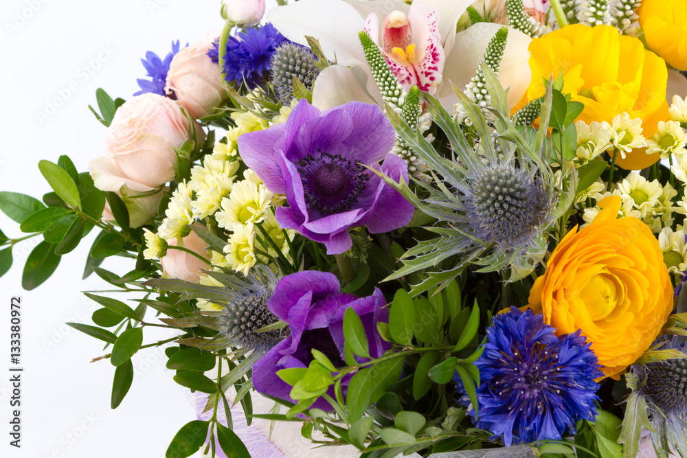 Obraz premium Bright buketny composition from fresh flowers, the white isolated background