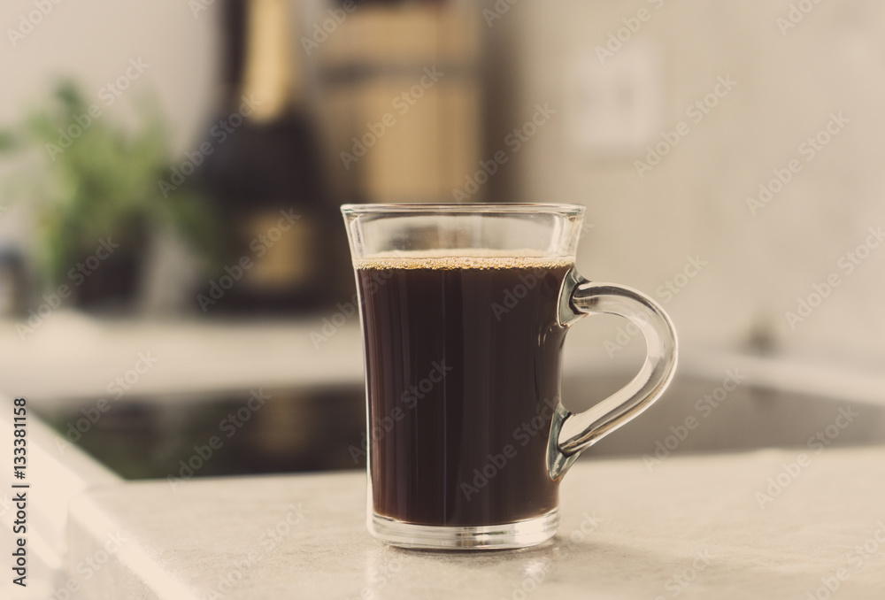 Cup of coffee on the white background. Shallow depth of field. Toned image. Cup of coffee on the white background. Shallow depth of field. Toned image.