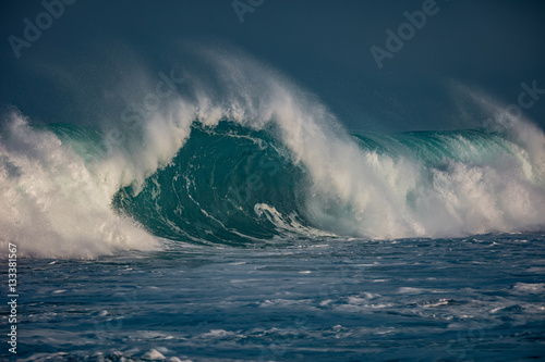 Huge waves crashing in ocean. Seascape environment background. Water texture with foam and splashes. Hawaiian surfing spots with nobody