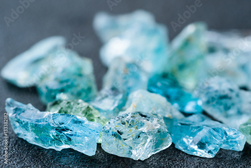 Collection of lovely blue uncut aquamarine gemstones. photo