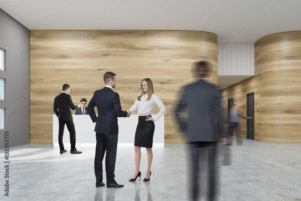 People in office with wooden walls