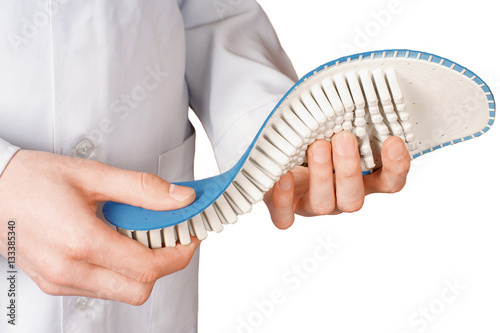 Doctor shows Individual orthopedic insoles