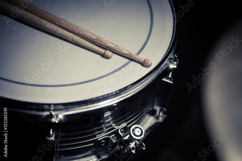Snare drum and a pair of drum sticks