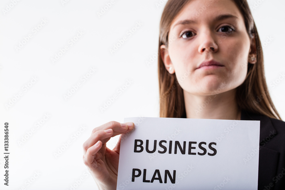 woman showing a business plan sign woman showing a business plan sign